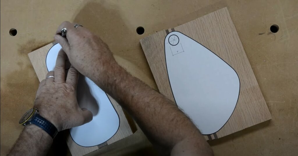 Drawing the shape of the serving board with a pattern.